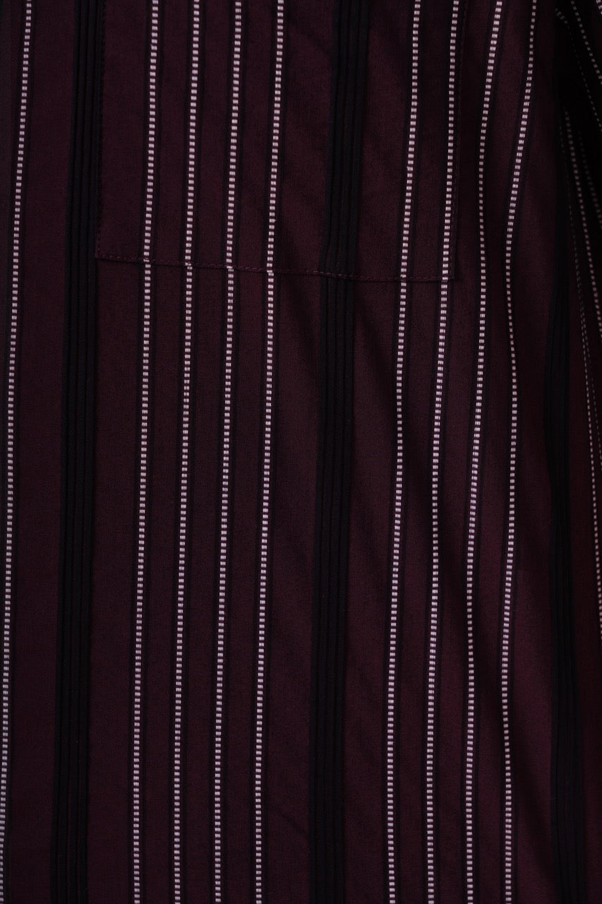 Close-up of a dark maroon fabric with thin white stripes