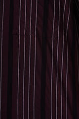 Close-up of a dark maroon fabric with thin white stripes
